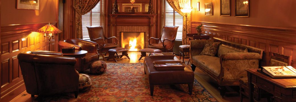 den with fireplace at the Bass Cotage Inn